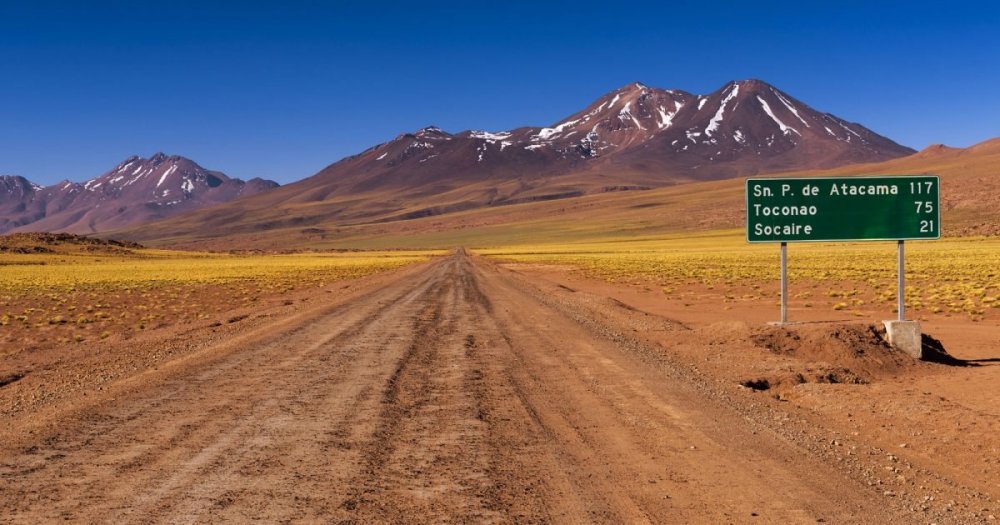 chile-atacama-desert-dirt-road-and-sign-istk-1200x630-c-center.jpg
